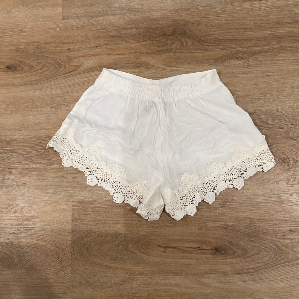 white shorts with detailing on bottom